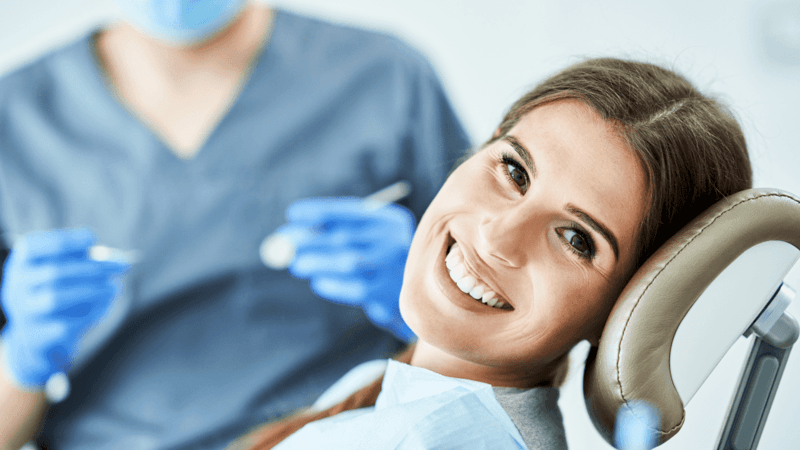 A smiling woman who is no longer experiencing dental pain in Longmont, CO